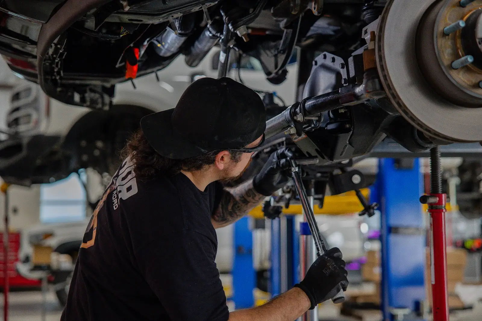 Performance Upgrades Mechanic performing performance upgrades on truck at THOR Off-Road shop